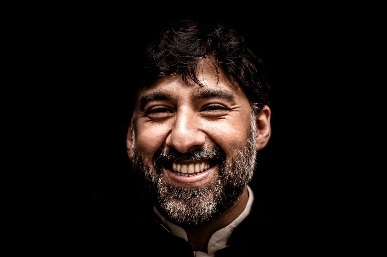 Man smiling with stained teeth