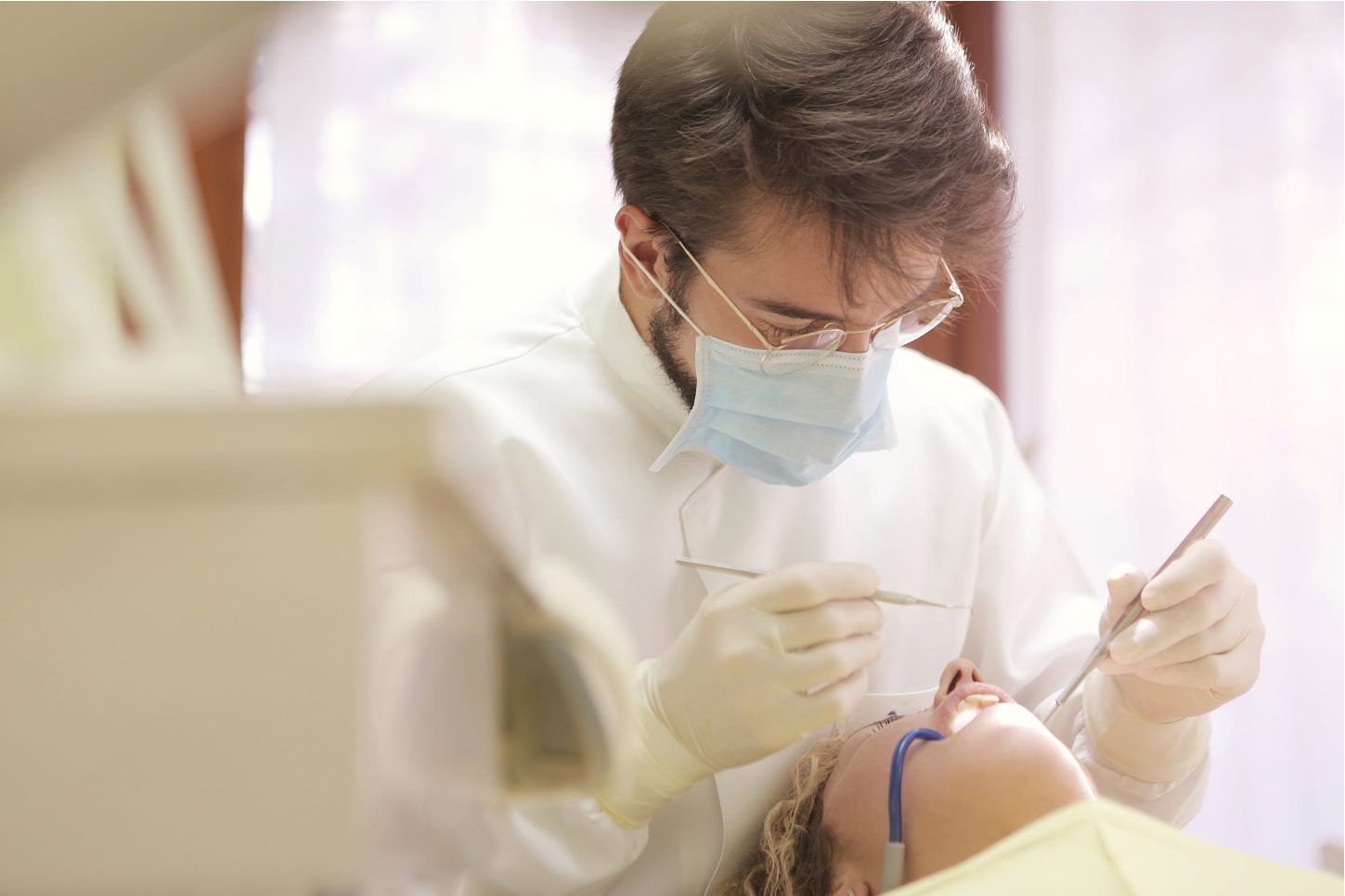 Dentist working on patient Dentist working on patient